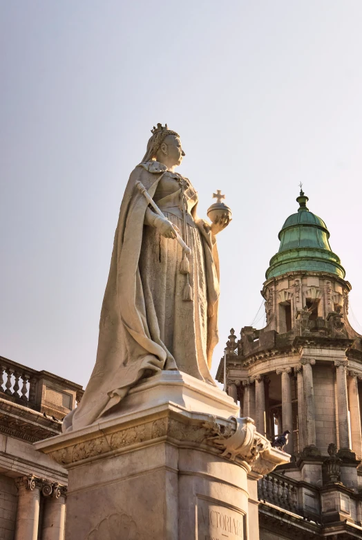 a statue that has a religious cross on it