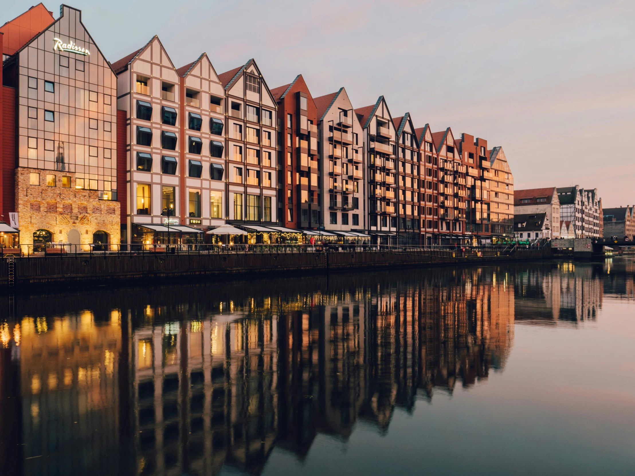 a group of buildings along the river bank