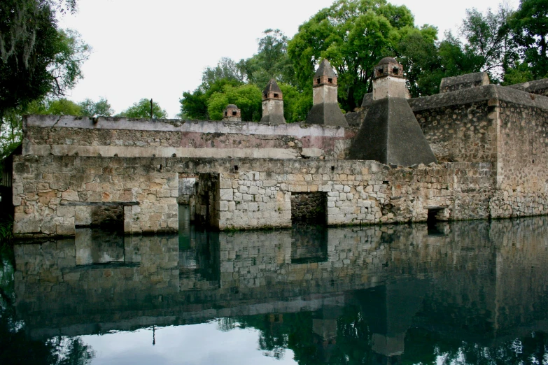 a wall of some sort next to some water