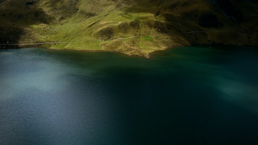 an aerial s shows the blue waters and green hills