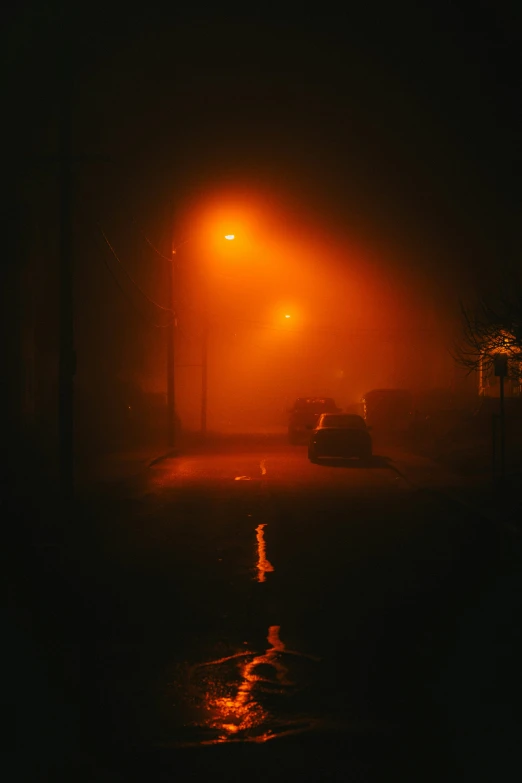 there is a car in the fog at night