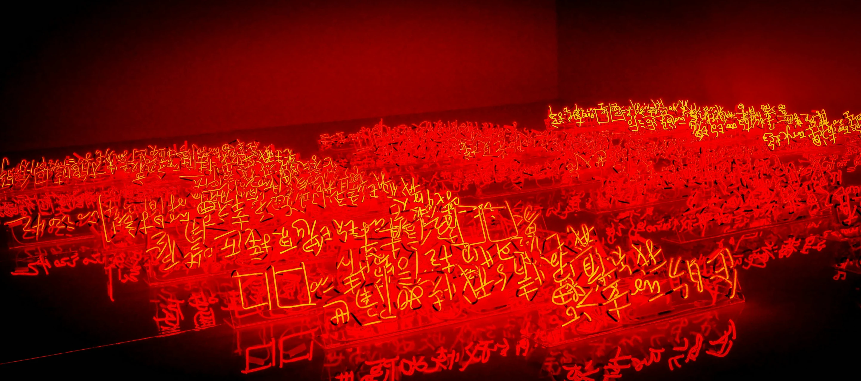 the room has many red images on the wall