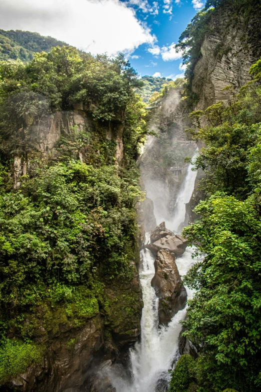 a large waterfall with lots of water falling down it