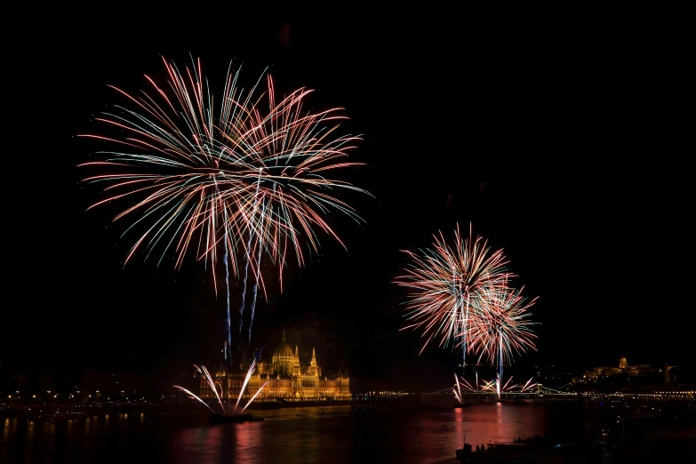 fireworks in the air over a city at night