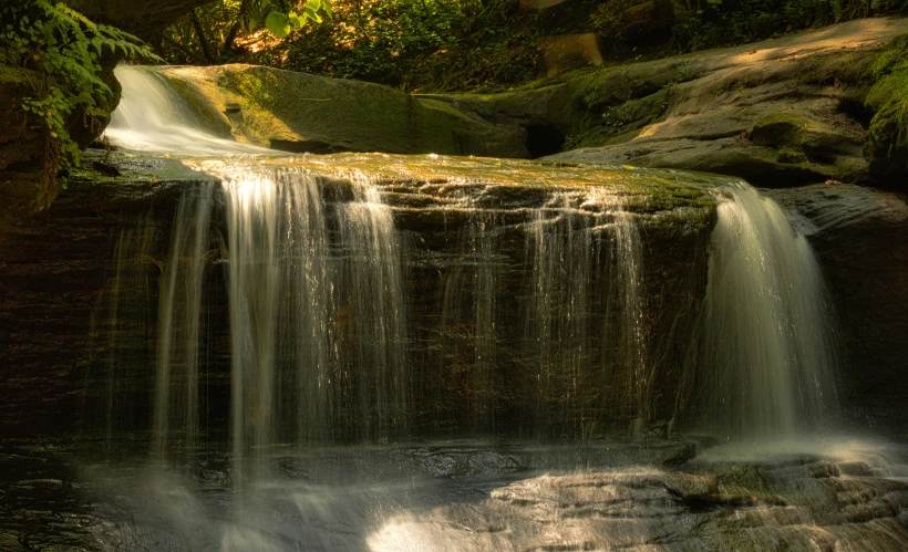 the small waterfall is close to the ground