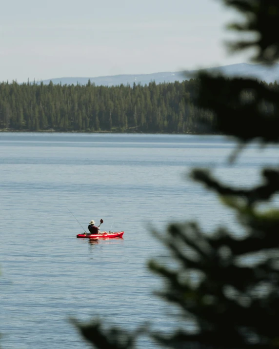 man in kayak alone out in the open water