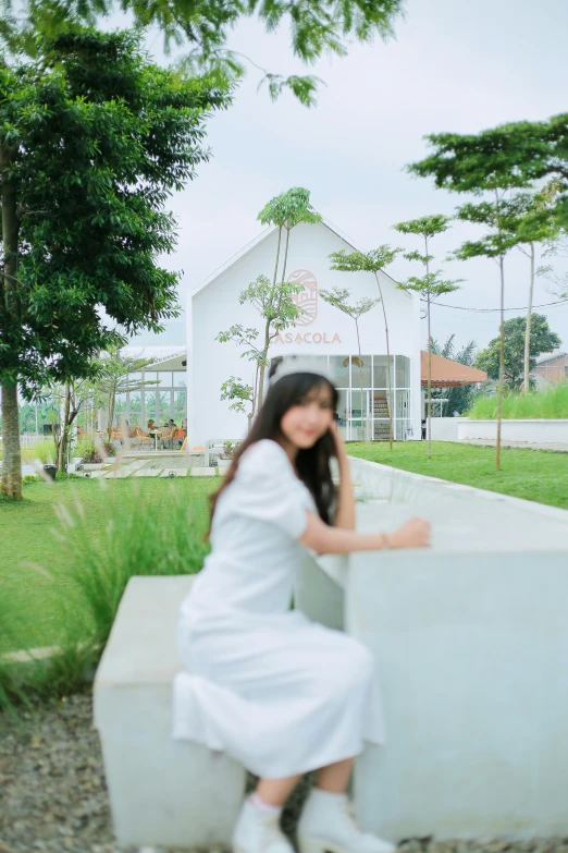 a woman with her hand on a cement block