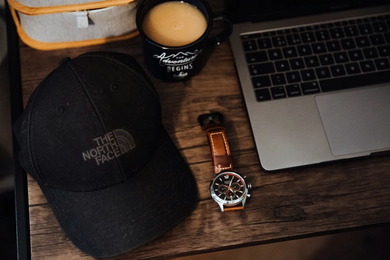 a baseball cap on top of a wooden table