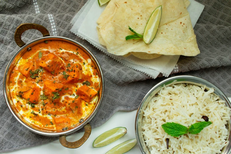 a meal consisting of some curry, rice and chapati