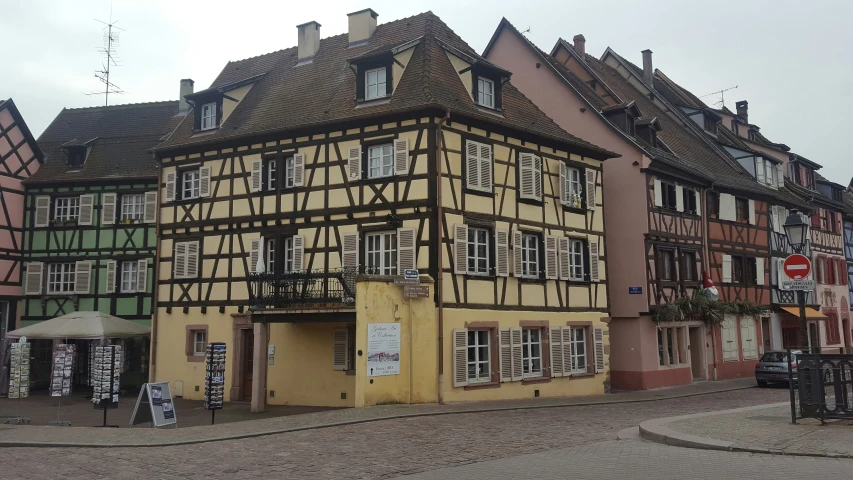 a cobblestone street with old buildings on both sides