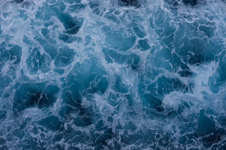 an image of ocean waves crashing into the beach