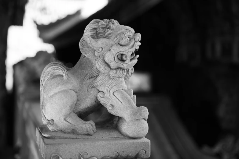 an animal statue sitting on top of a wooden table