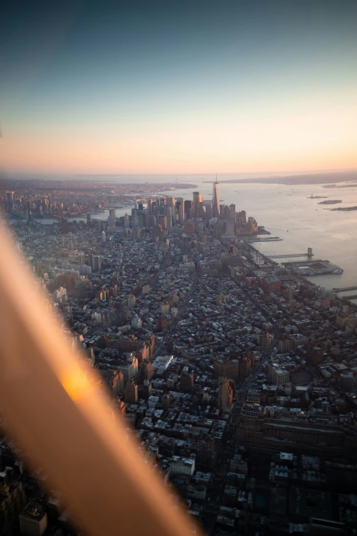 the view from the window of an airplane over a large city