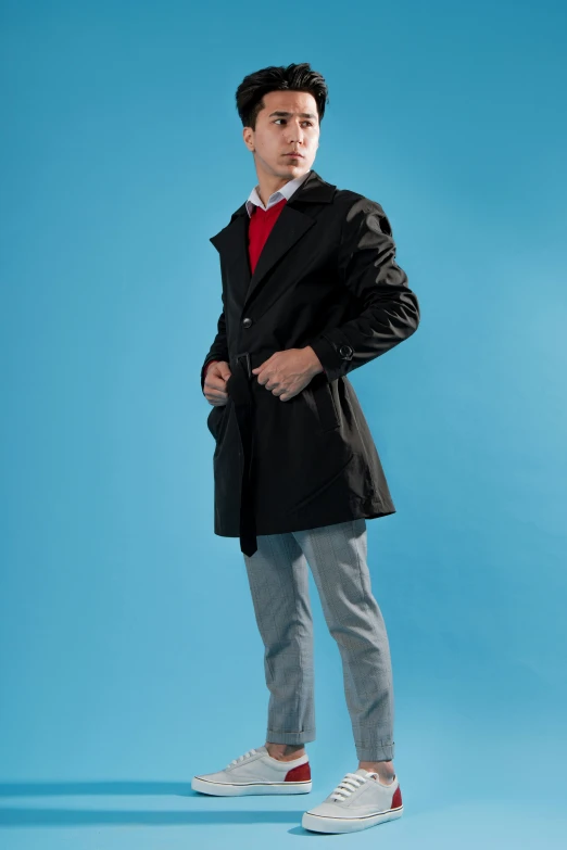 a person with a jacket on standing up