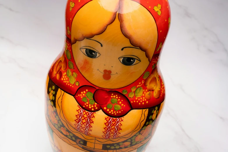 a colorfully decorated vase with a decorative face