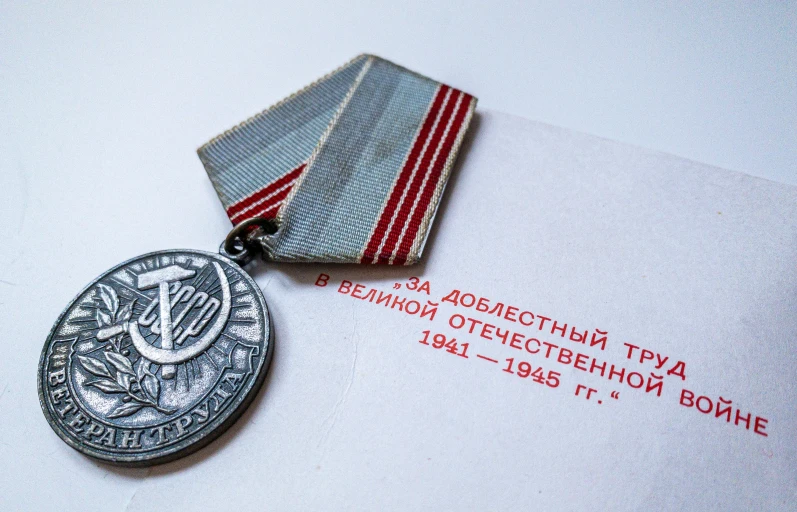 a medal sitting on top of a white table