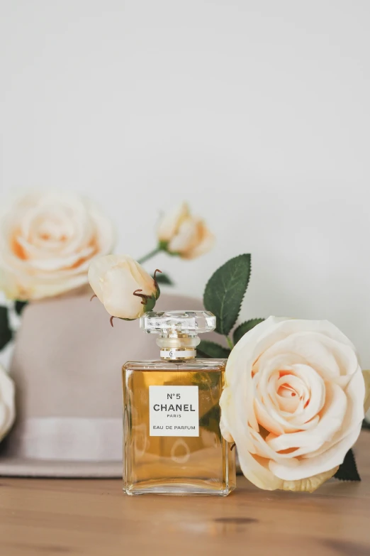 an old perfume bottle sitting on top of a table