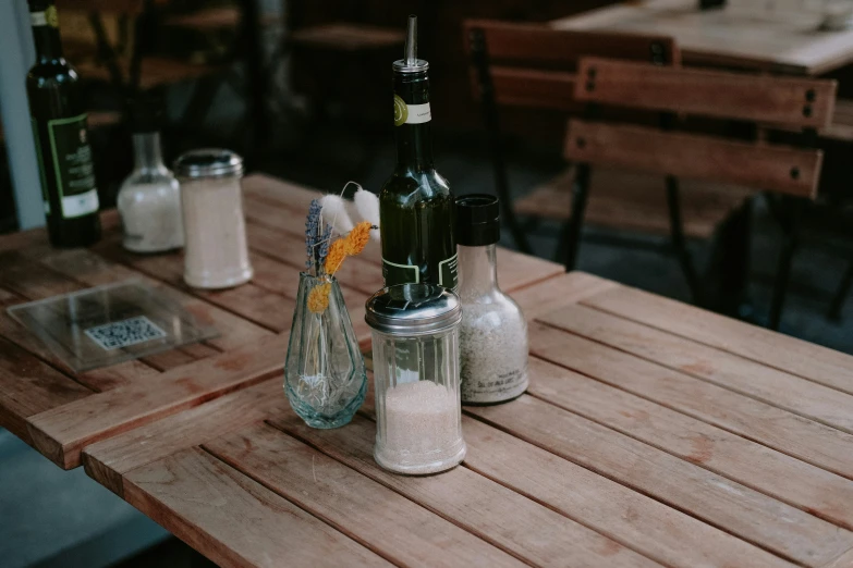 there is a table with some salt and condiments on it