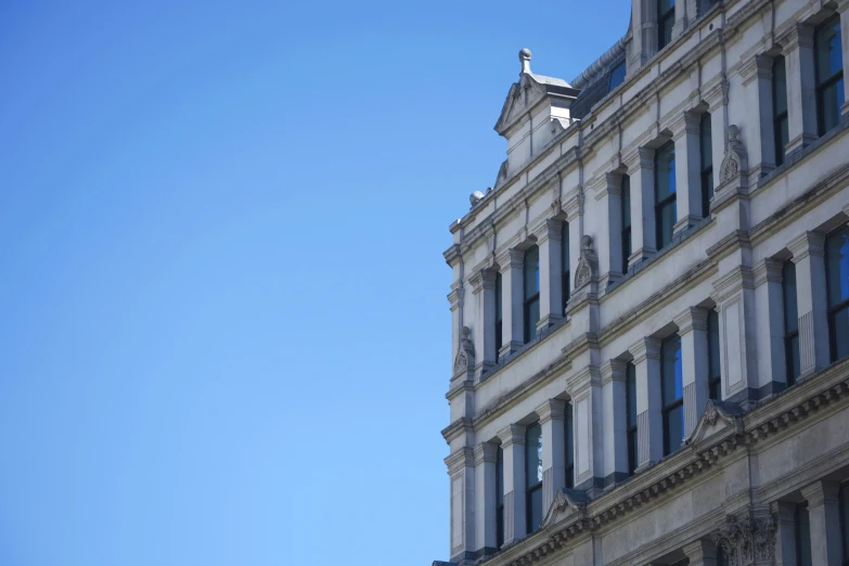 a tall building with some windows in front of it