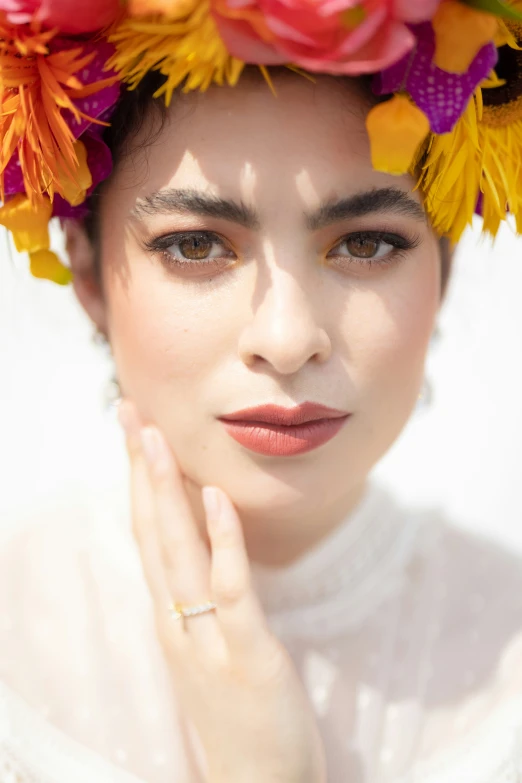 a woman with a colorful wreath of flowers on her head