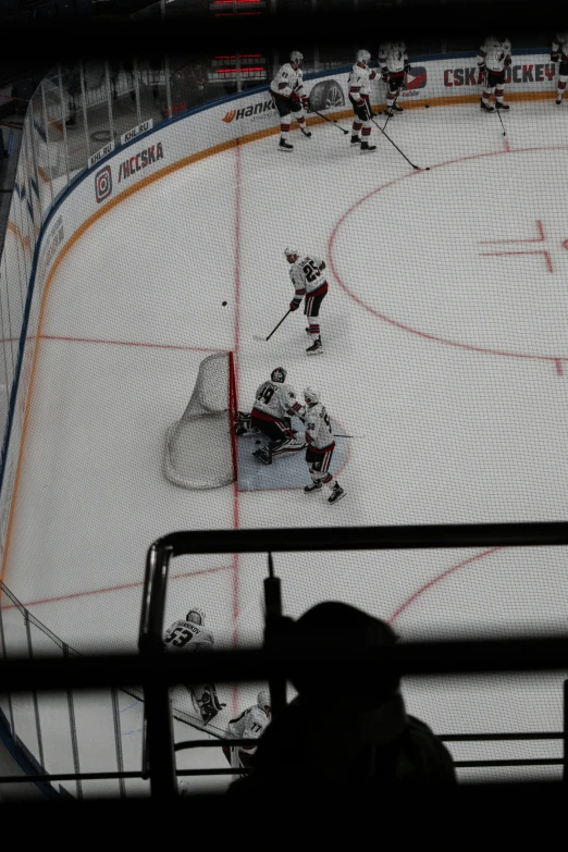 hockey players are playing at the ice rink