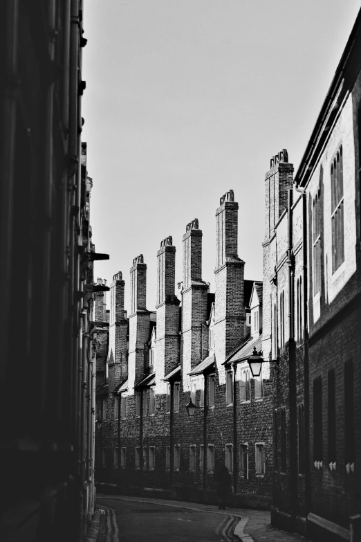 a black and white picture of some very big buildings