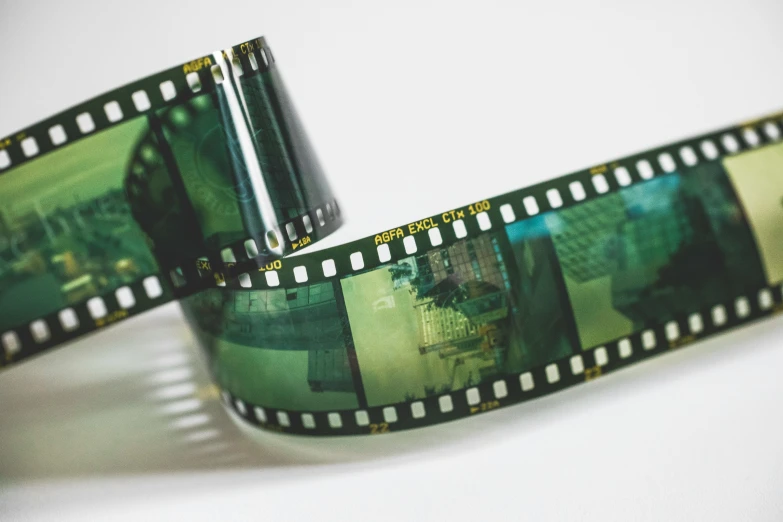 film strips with green pictures are stacked together