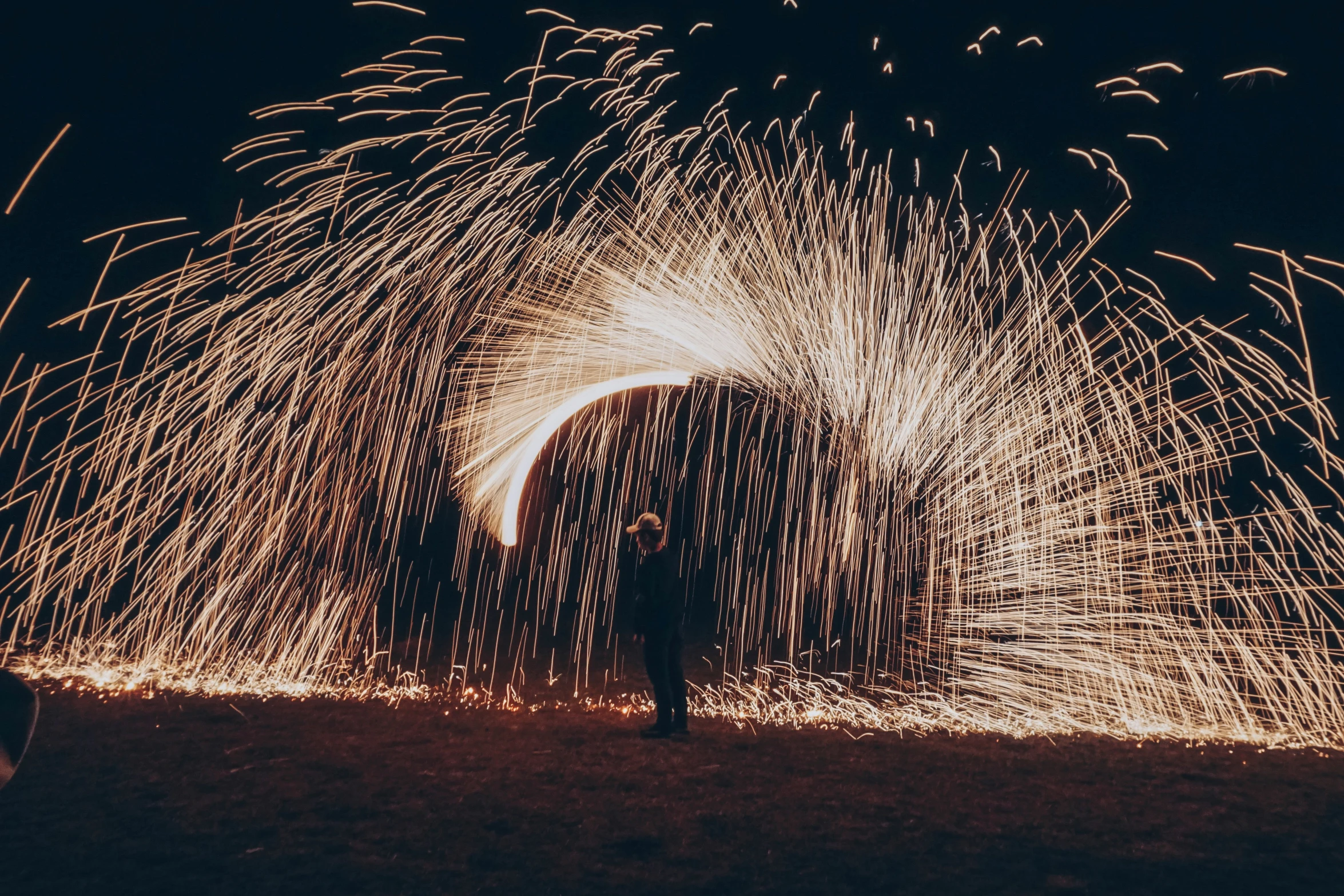 a dark background of firework at night