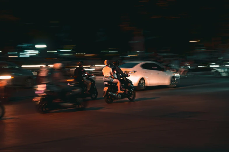 a motorcycle driving down a busy city street