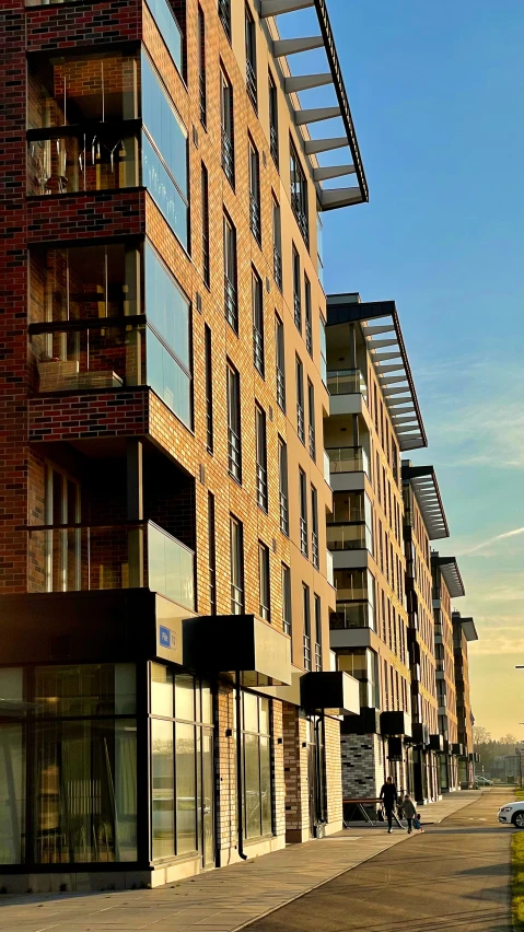 a tall building with a street corner in front of it