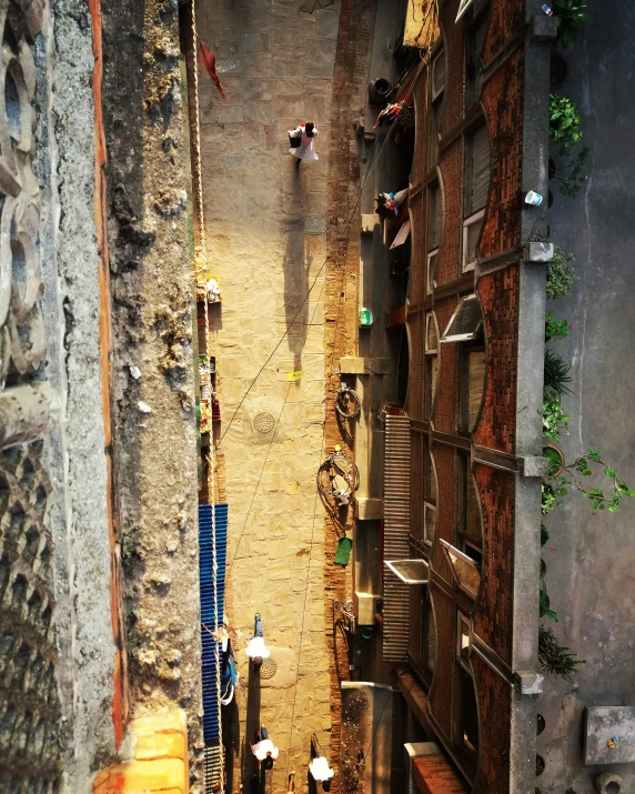 a street view looking down at pedestrians walking down it