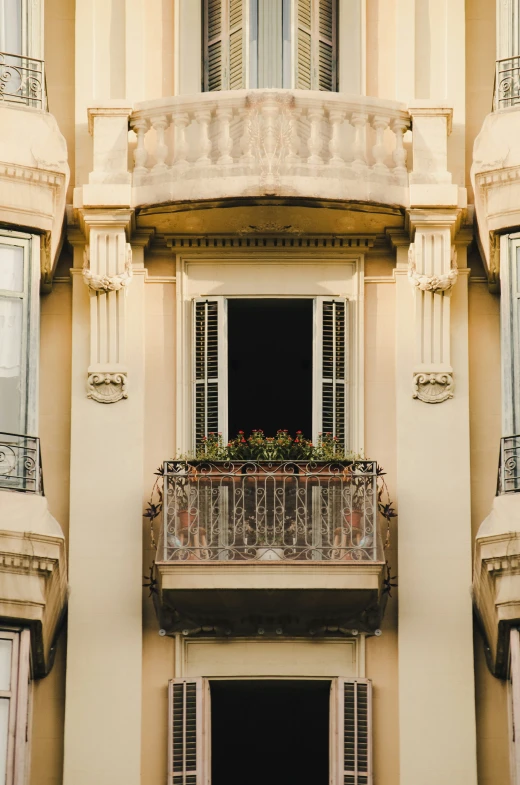 the balcony outside the apartment has balconies and windows