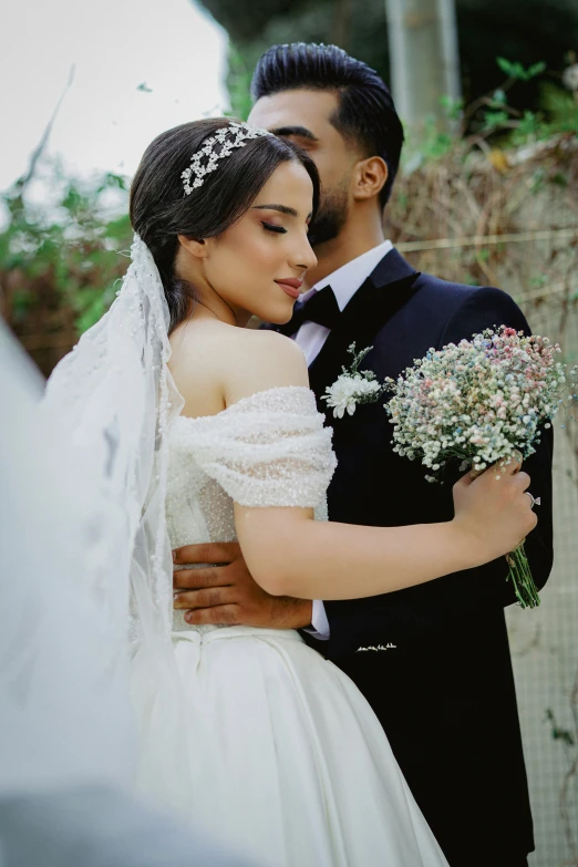 a man in a suit and a woman in a wedding dress emcing