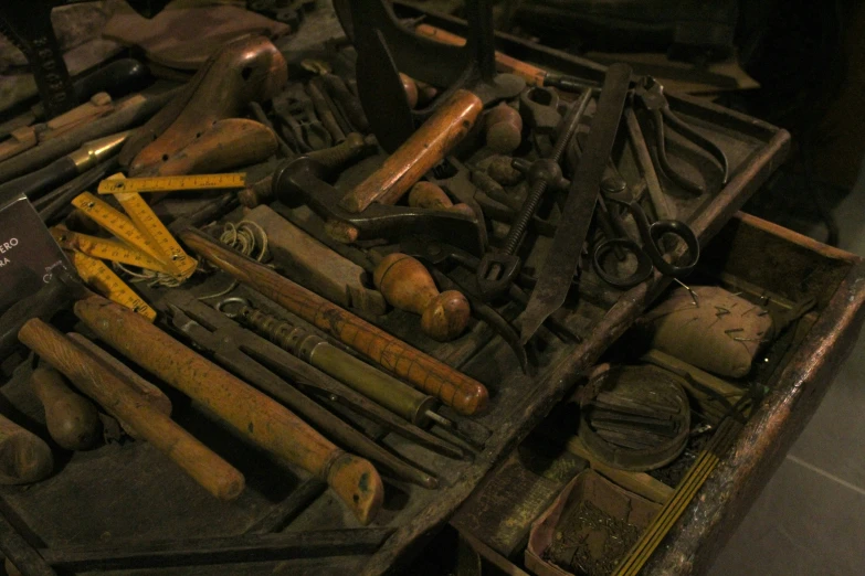 tools that are laying out in a tool box