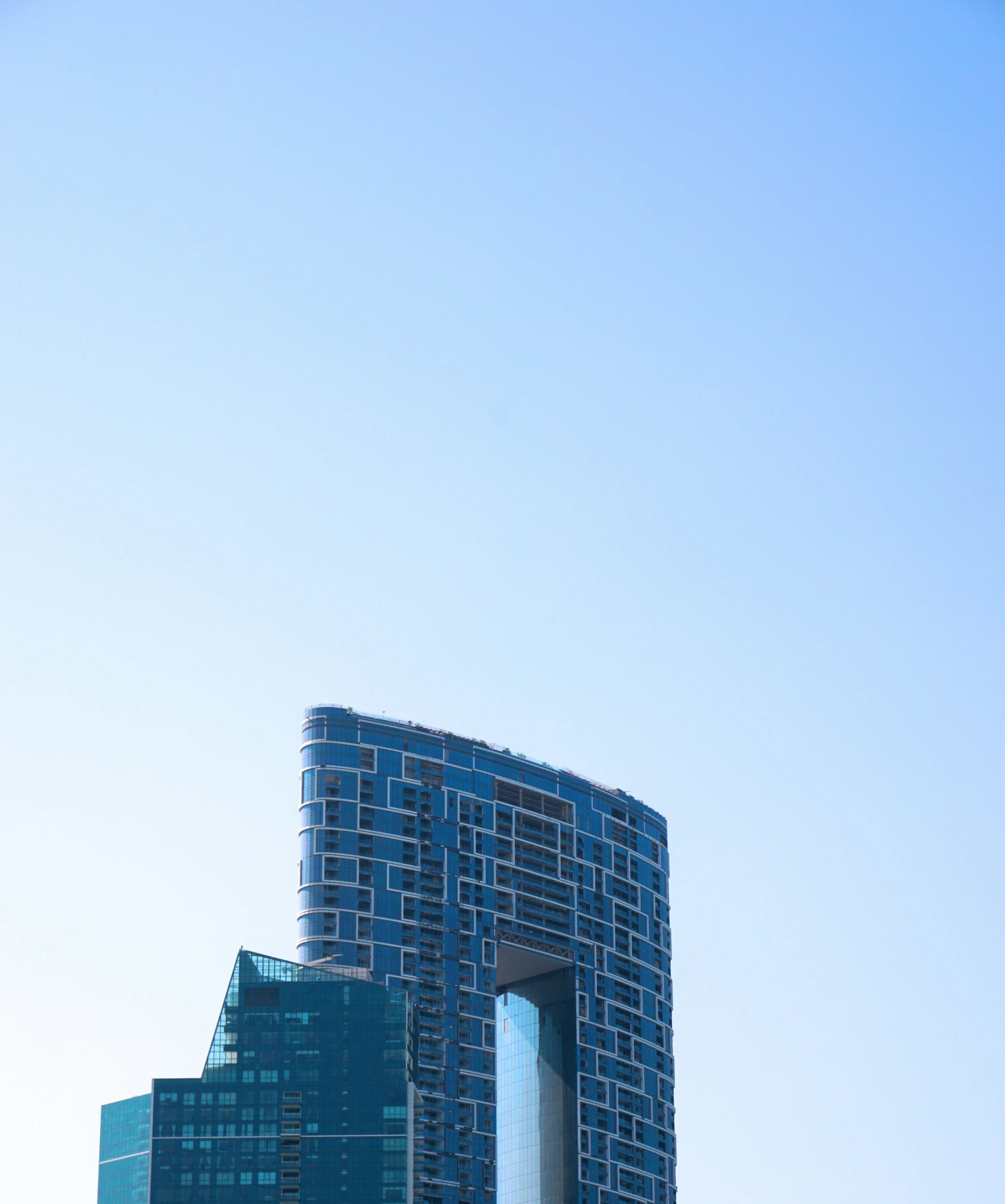 very tall buildings surrounded by tall glass windows