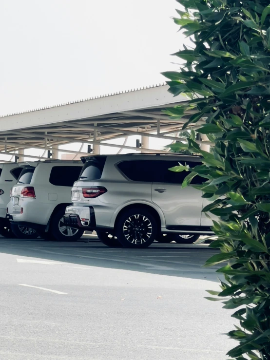 a row of cars parked in a parking lot