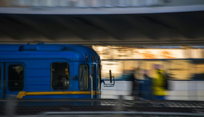 the train is stopped as people stand by it