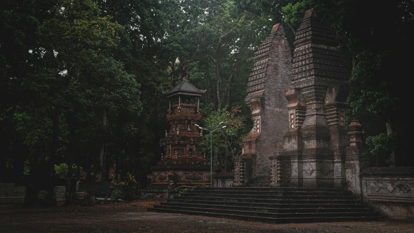 an image of a graveyard with a tower