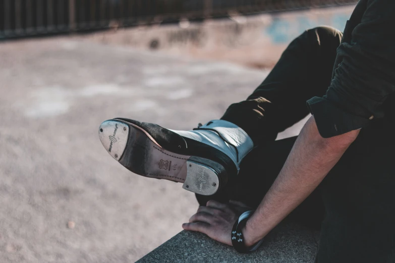 the boy is riding his skateboard on the curb