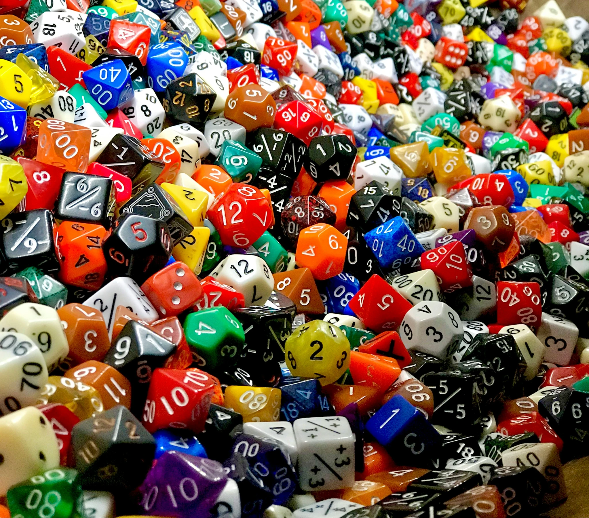 a large pile of random dices piled next to each other