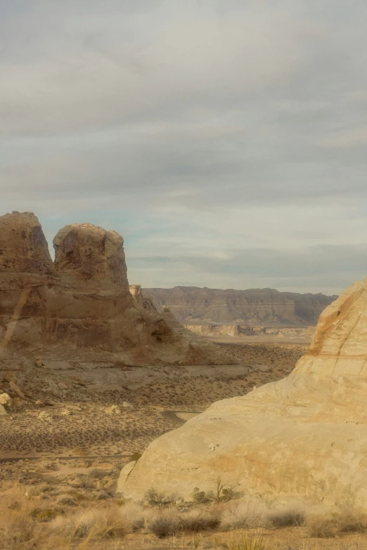 a landscape scene of two large rock formations