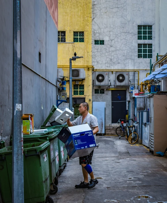 a man moving a box down a street