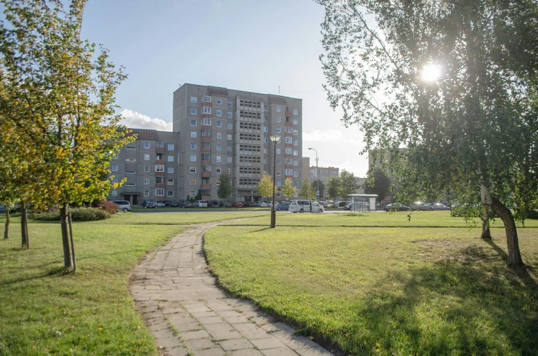 pathway to apartment building in a grassy area