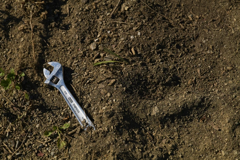 a tool laying on top of the ground