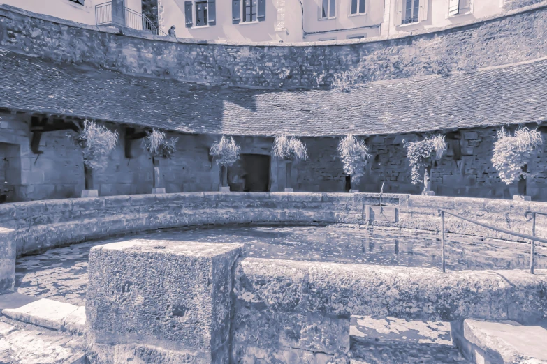 a stone building has several windows near it