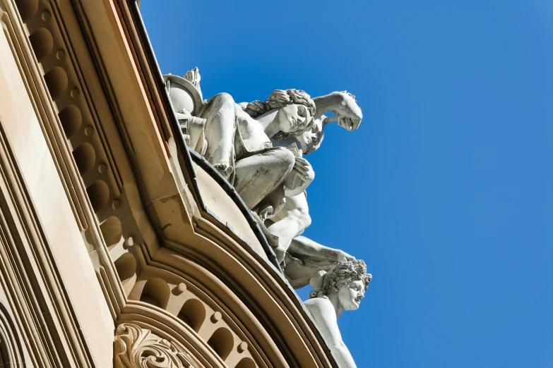 a statue sits on top of the building