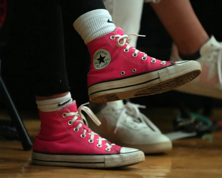 several feet in tennis shoes on the court