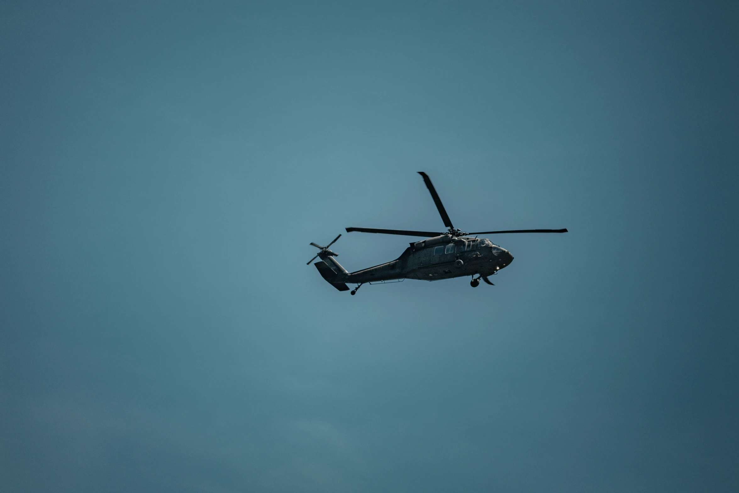 a helicopter that is flying in the air