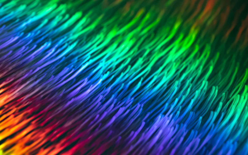 a close up view of rainbow colored background