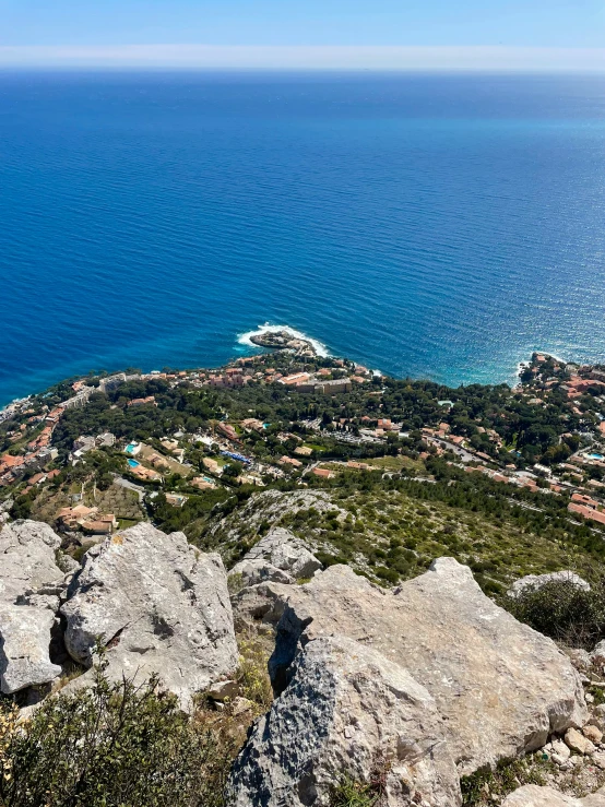 aerial view of ocean with large rock outcropping